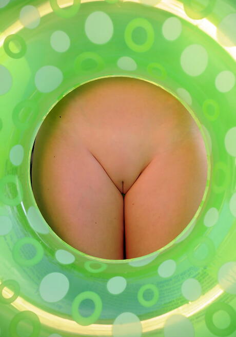 Svelte ukrainian brunette youthful Serena Wood exhibits her butt and shaved pussy at pool