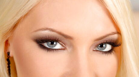 Very attractive blonde babe Gabriela in lingerie exhibiting her butt and spreading her legs 