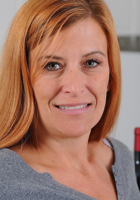 Superb mature Anita Coxxx in jeans exposing big tits and spreading her legs in the kitchen